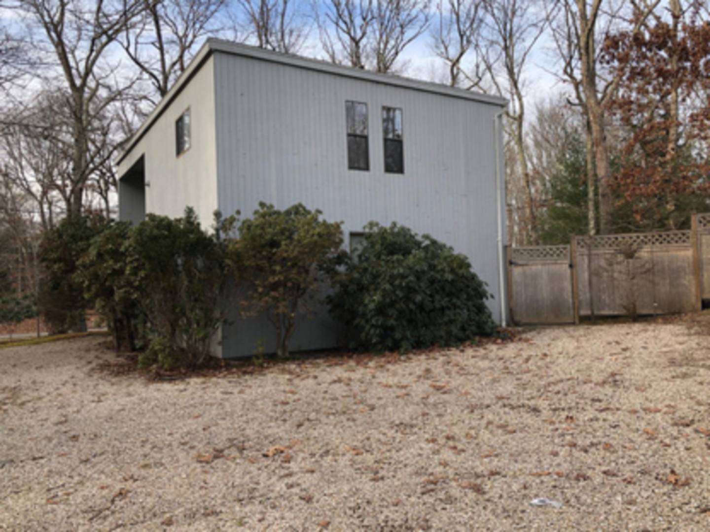 141 Roses Grove Road Southampton, NY 11968 - Photo 10 of 10 a backyard of a house with lots of green space