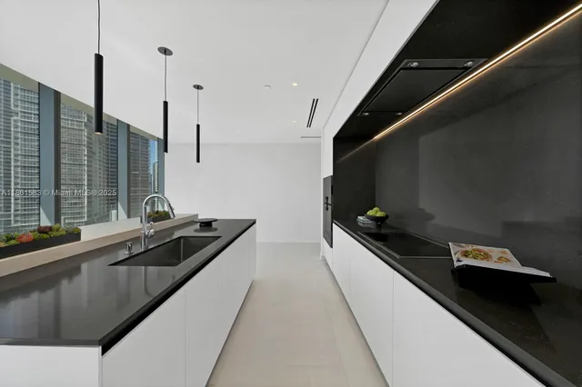 a kitchen with a sink and stove
