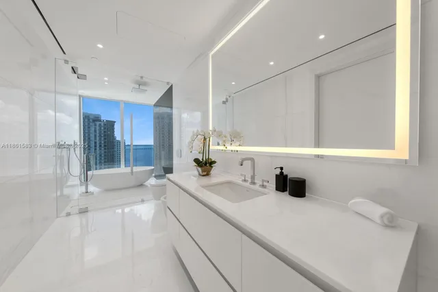 a bathroom with a sink double vanity and shower
