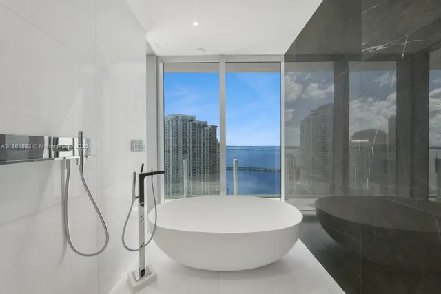 a bathroom with a toilet and shower