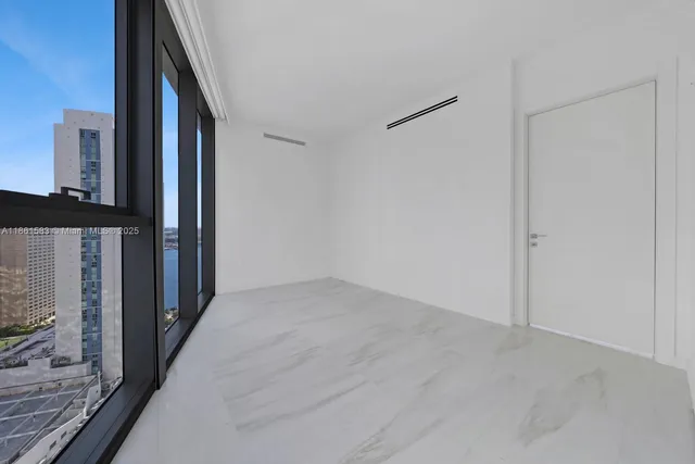 a bathroom with a shower a toilet and sink