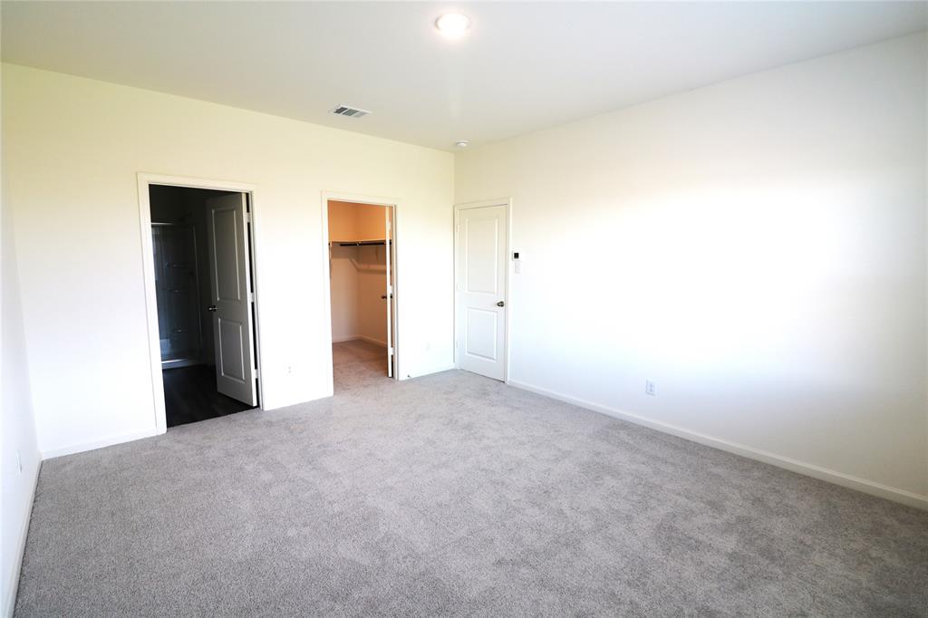 1301 Elliott Road Howe, TX 75459 - Photo 13 of 27 Neutral tone wall paint, recessed lighting, and soft gray carpeting