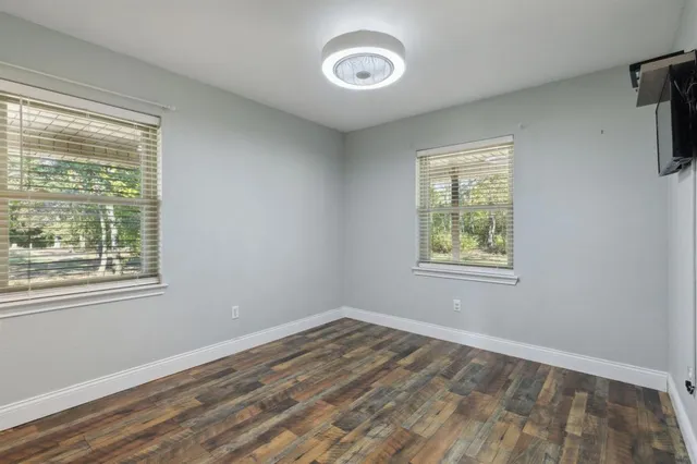 a view of an empty room with a window