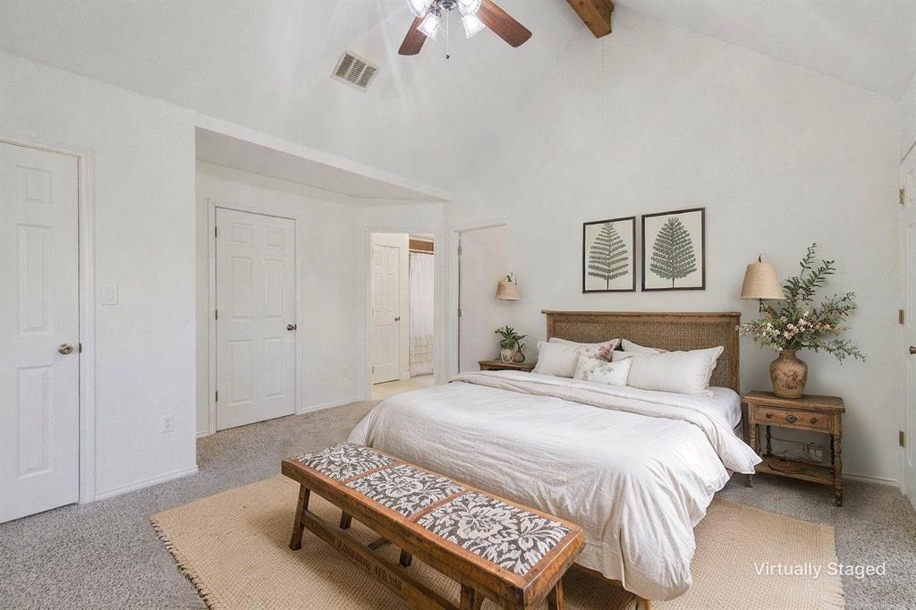 1133 VZ County Road Canton, TX 75103 - Photo 17 of 38 a spacious bedroom with a bed and a chandelier