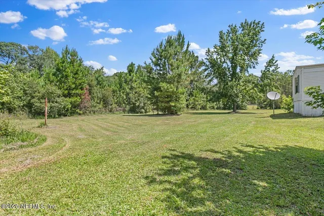 a house with swimming pool in front of it