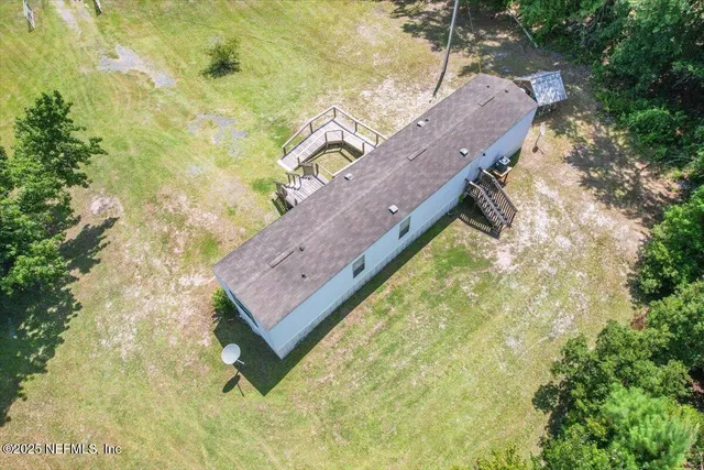 a view of a yard with a bench