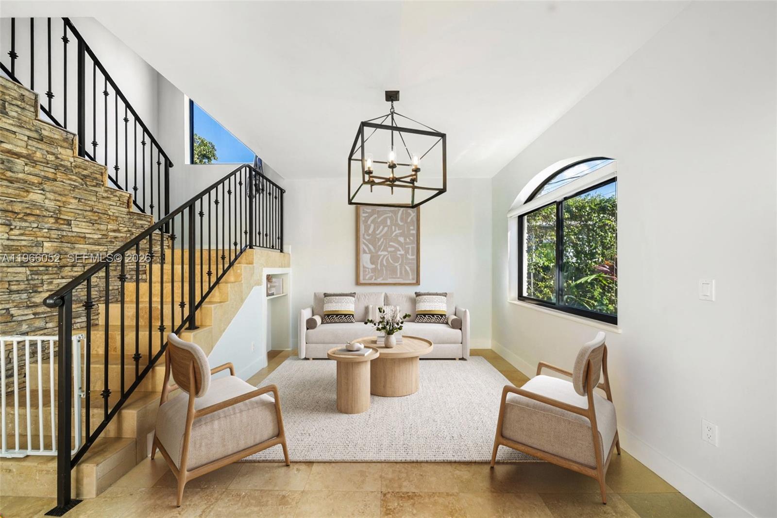 6001 Southwest 28th Street Miami, FL 33155 - Photo 3 of 30 a living room with fireplace furniture and a chandelier