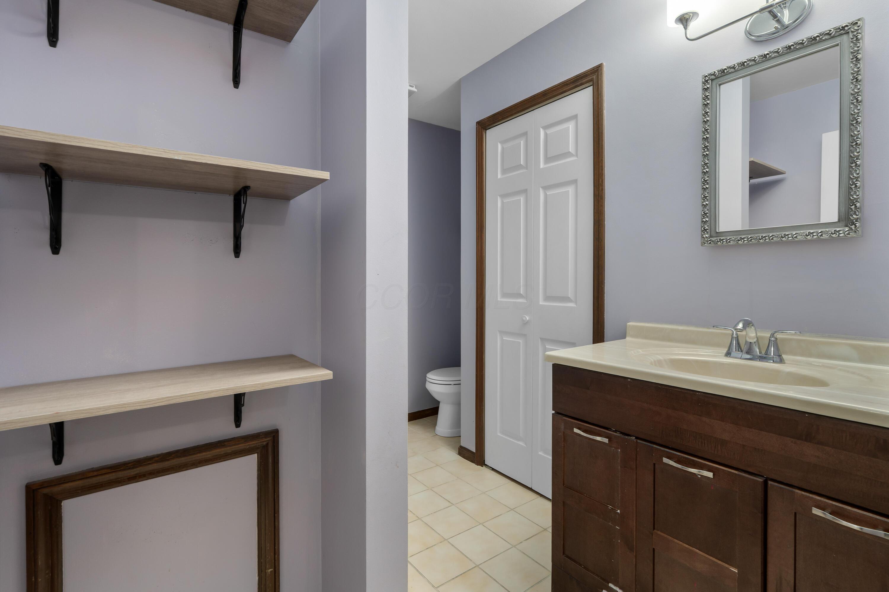 5879 Ravine View Court Columbus, OH 43231 - Photo 22 of 43 Full hall bath with lots of storage