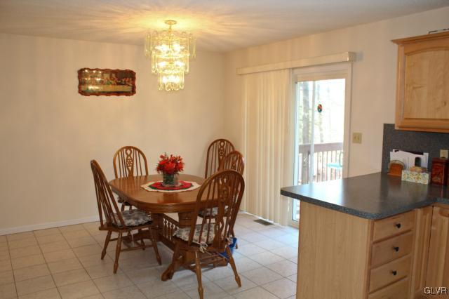 154 Ash Lane Kunkletown, PA 18058 - Photo 4 of 20 a view of a dining room with furniture and chandelier
