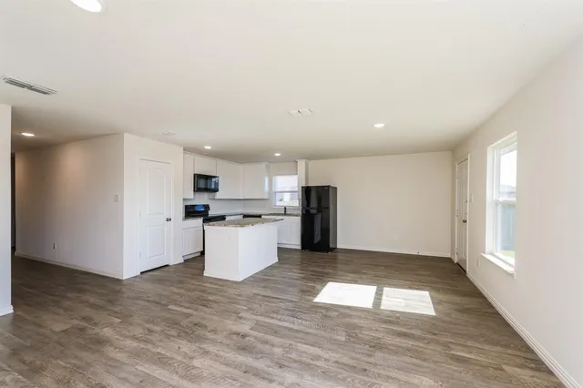 a view of kitchen with wooden floor