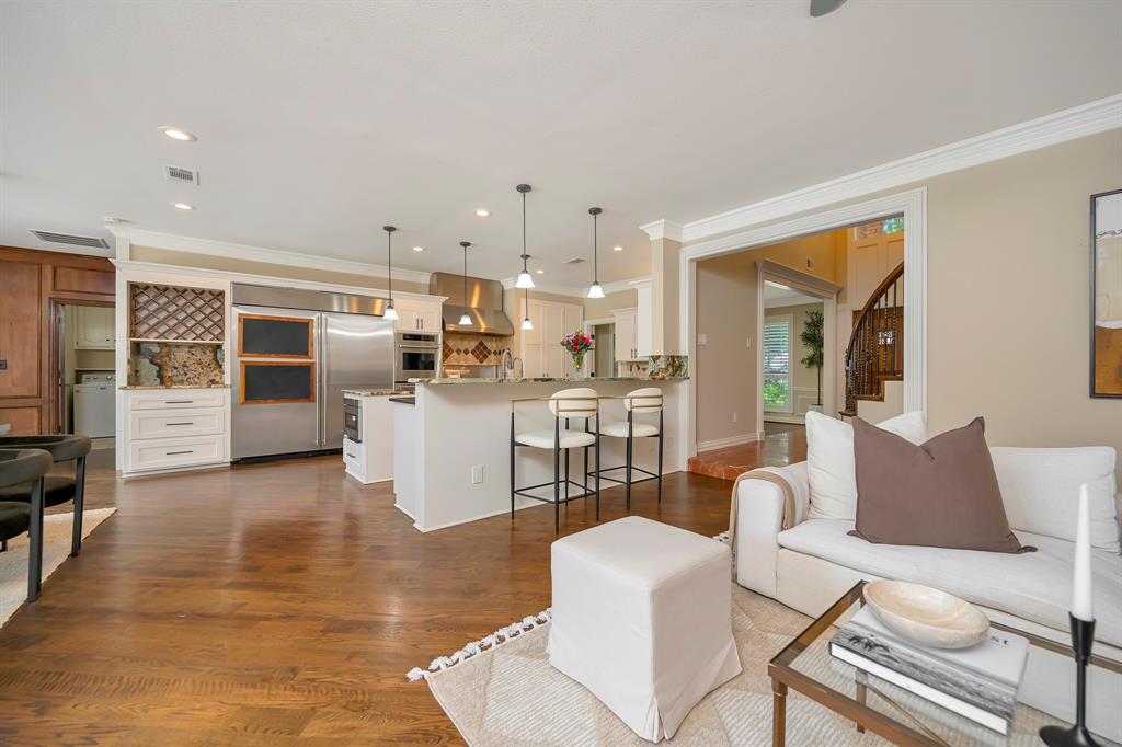 4008 Ramsgate Court Colleyville, TX 76034 - Photo 14 of 33 Open-concept living area featuring rich wood-finish flooring, recessed lighting, and crown molding
