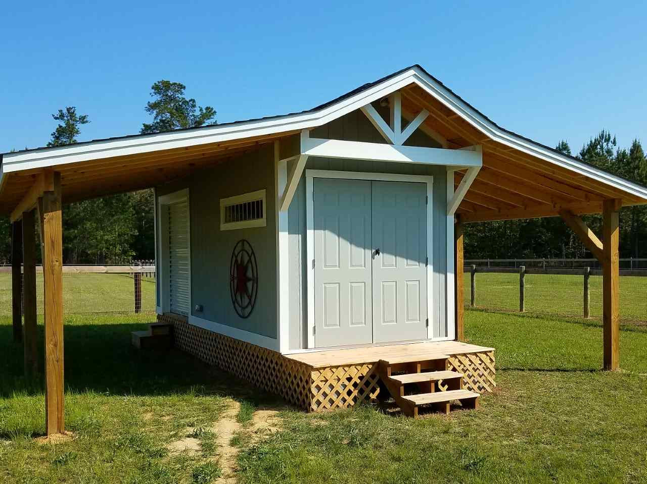1522 Freedom Road Smithfield, NC 27577 - Photo 25 of 25 8’x24’ with two 8’ overhangs – full electric and outdoor outlets for golf cart and treadmill or other training equipment; shelving in feed room; 6’ roll up door in separate storage section Feed/Storage Shed