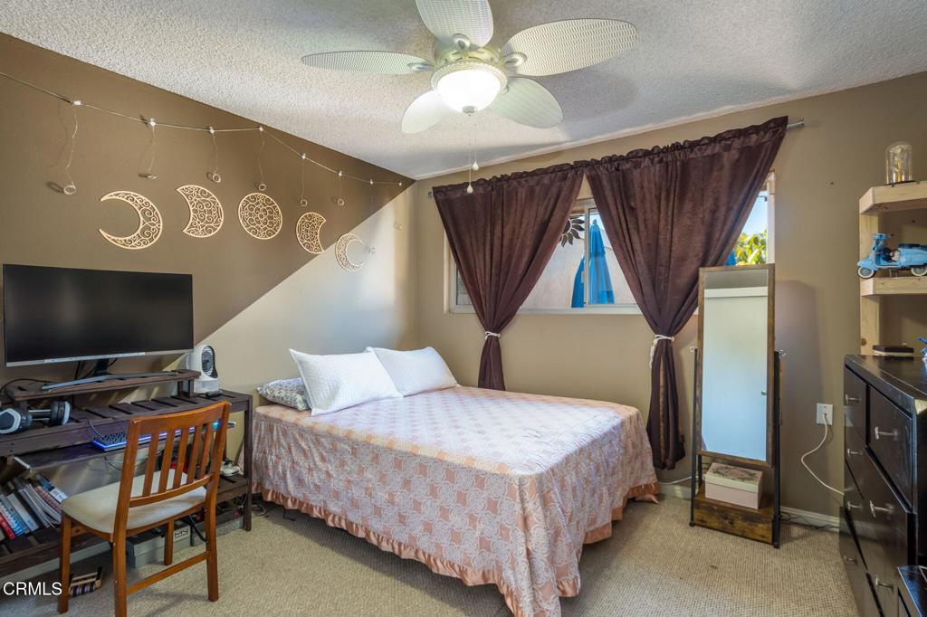 3610 Isle Way Oxnard, CA 93035 - Photo 16 of 25 a bedroom with a bed and a flat screen tv