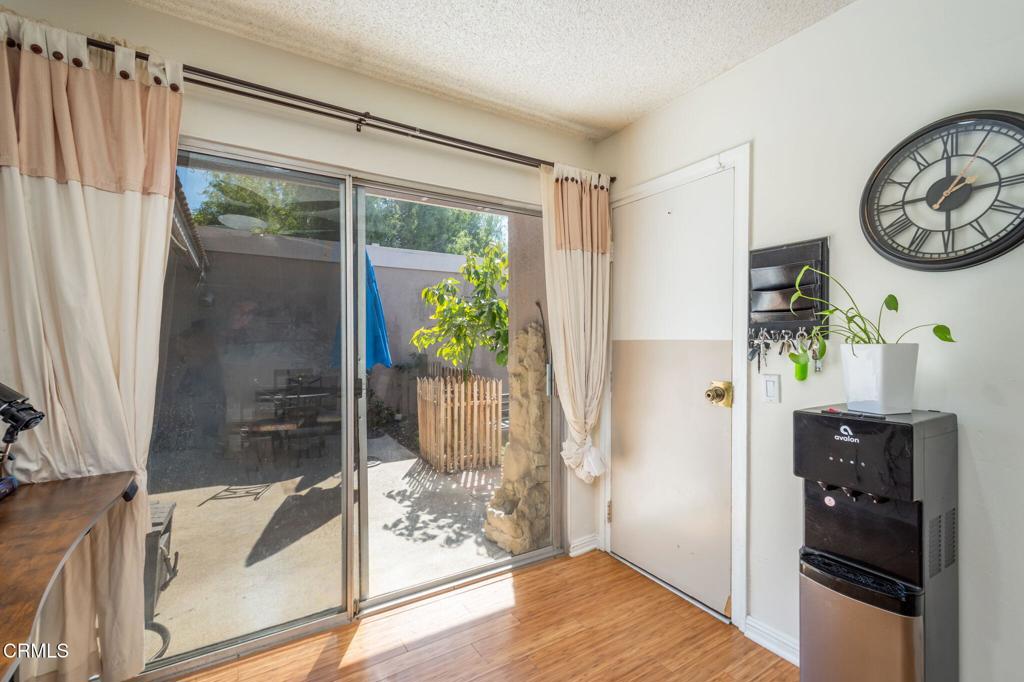 3610 Isle Way Oxnard, CA 93035 - Photo 19 of 25 a hallway with painting on the wall and a window