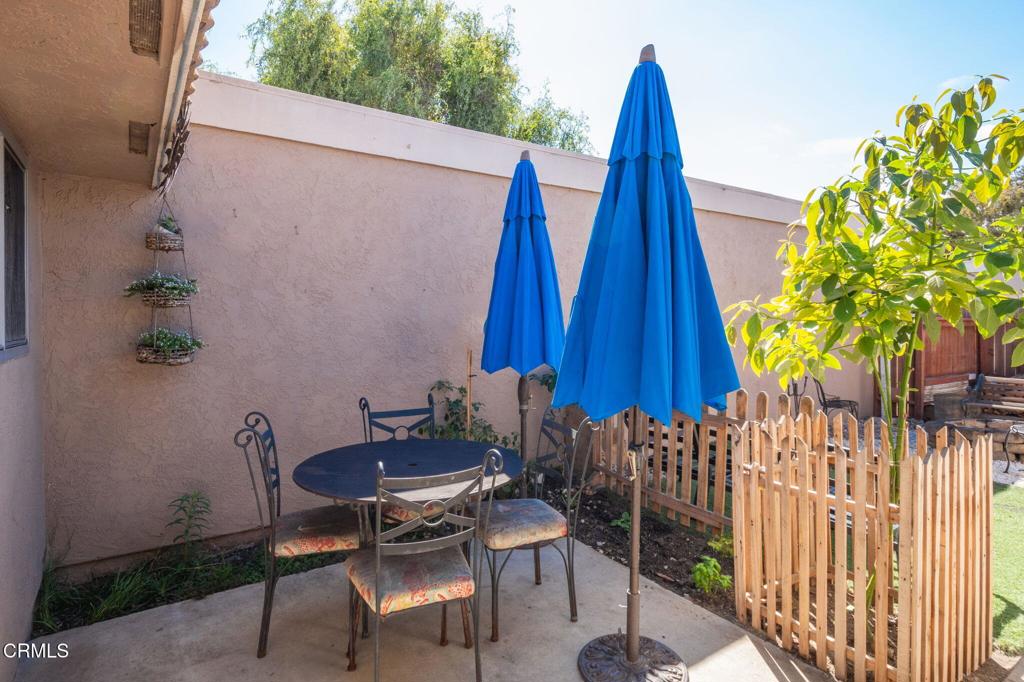 3610 Isle Way Oxnard, CA 93035 - Photo 20 of 25 a view of a backyard with a chair and a potted plant