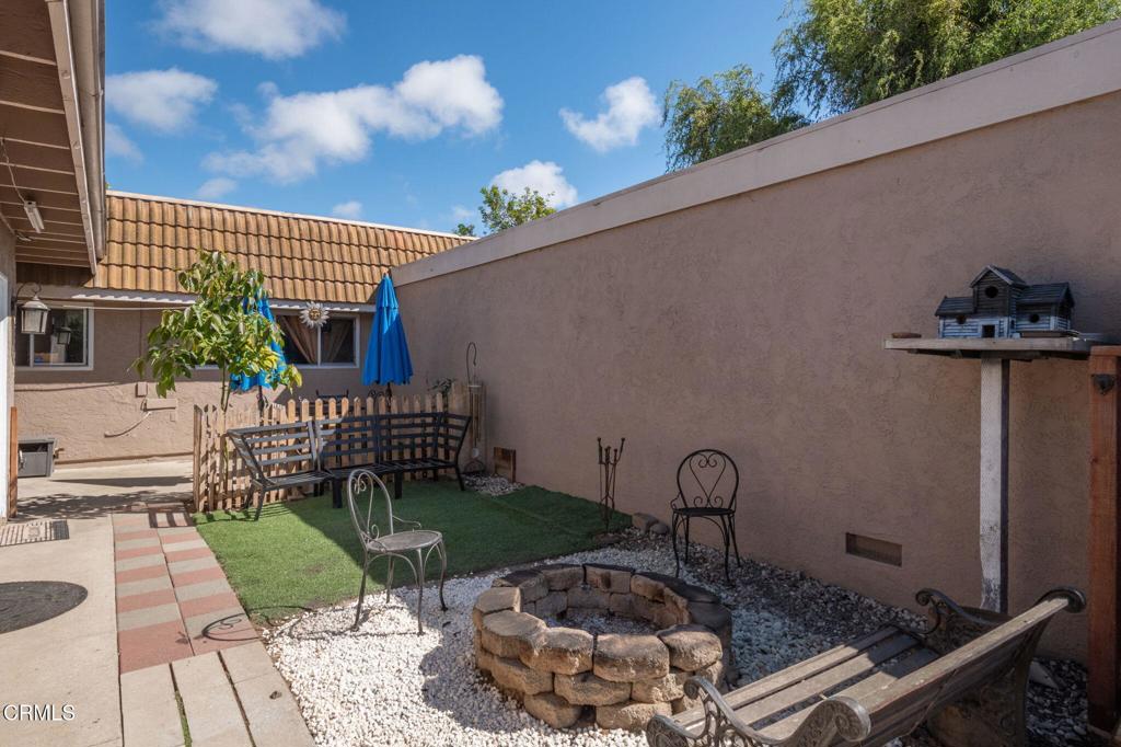 3610 Isle Way Oxnard, CA 93035 - Photo 22 of 25 a view of a patio with a table and chairs and potted plants