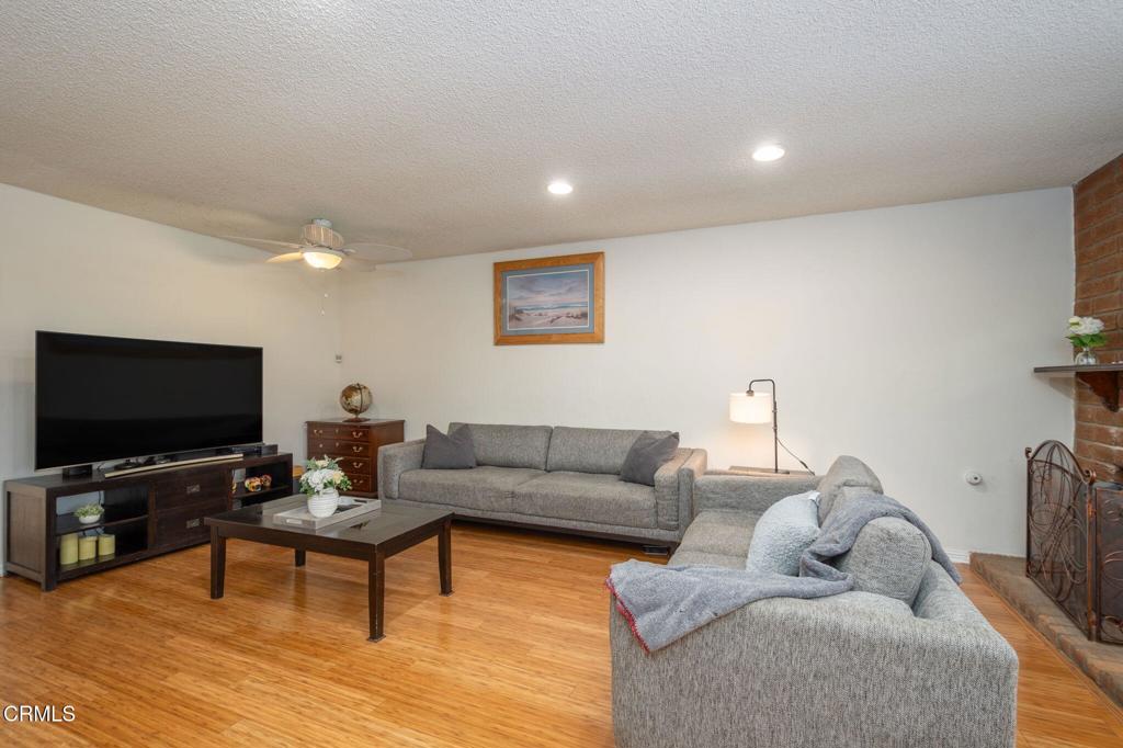 3610 Isle Way Oxnard, CA 93035 - Photo 5 of 25 a living room with furniture and a flat screen tv