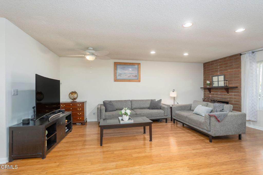 3610 Isle Way Oxnard, CA 93035 - Photo 6 of 25 a living room with furniture and a flat screen tv