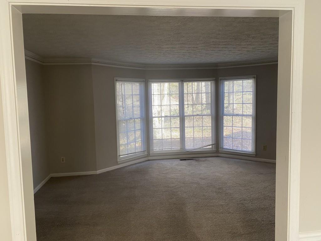 1720 Ridgefield Drive Roswell, GA 30075 - Photo 13 of 35 a view of an empty room with a window