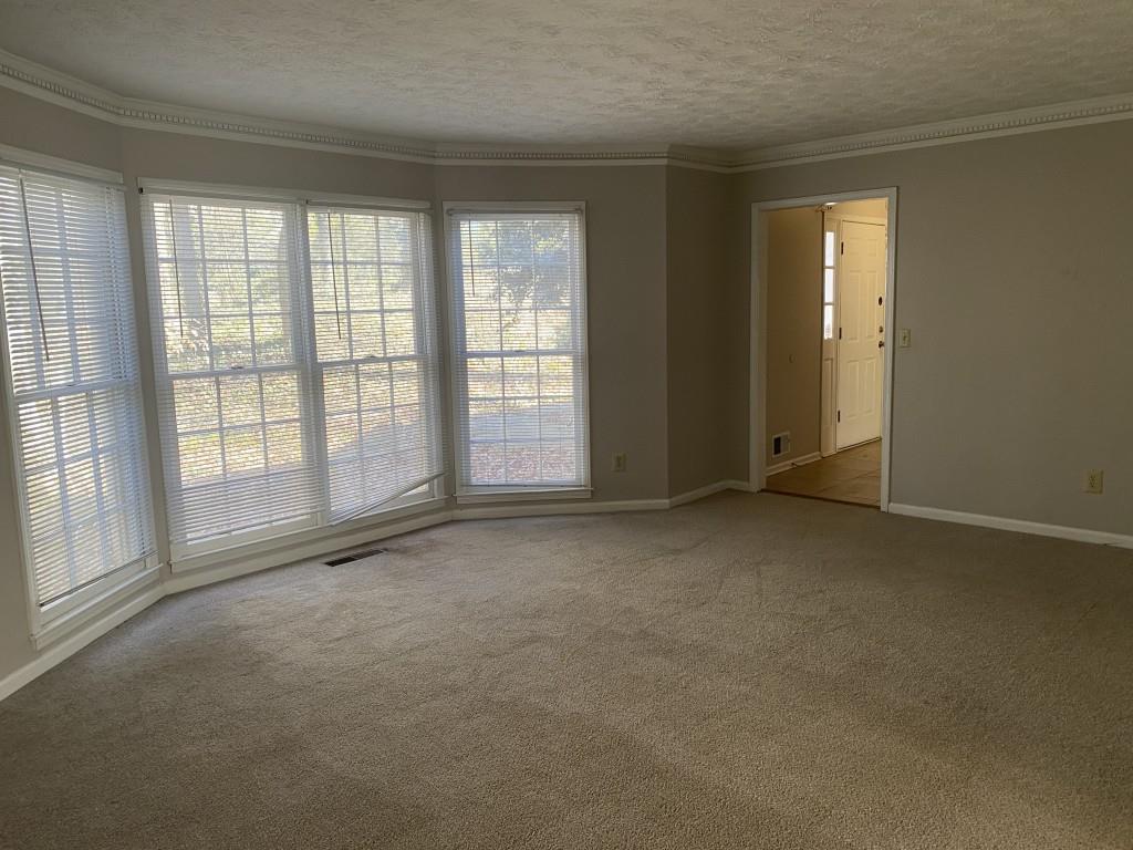 1720 Ridgefield Drive Roswell, GA 30075 - Photo 14 of 35 an empty room with windows