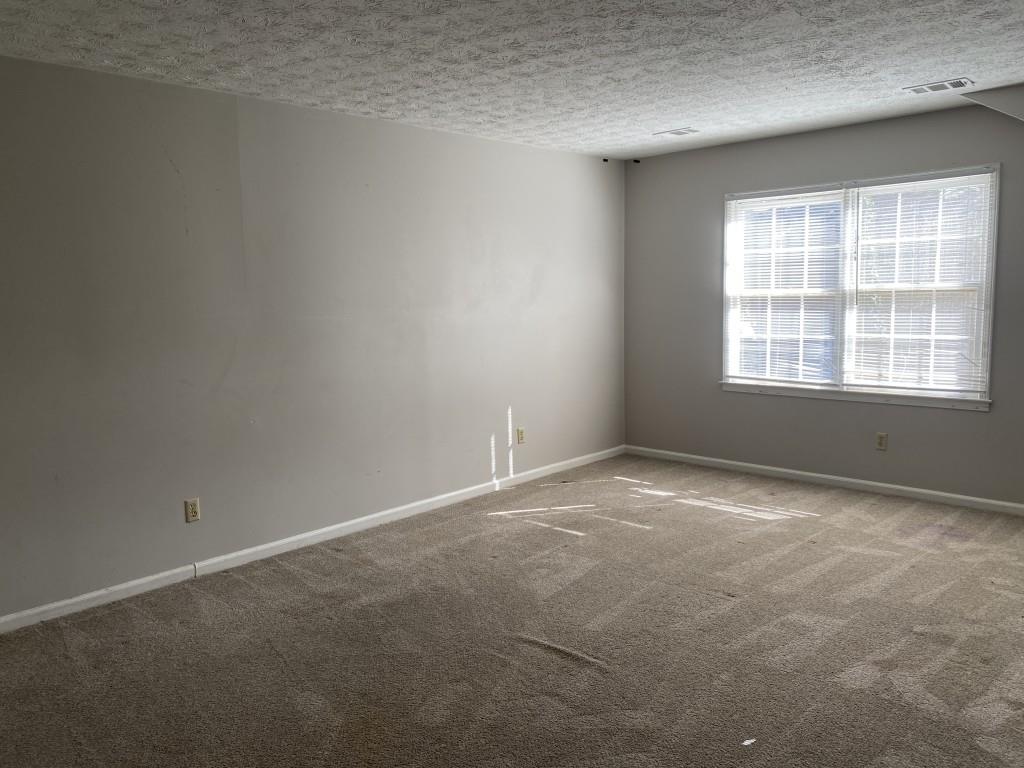 1720 Ridgefield Drive Roswell, GA 30075 - Photo 16 of 35 an empty room with a window