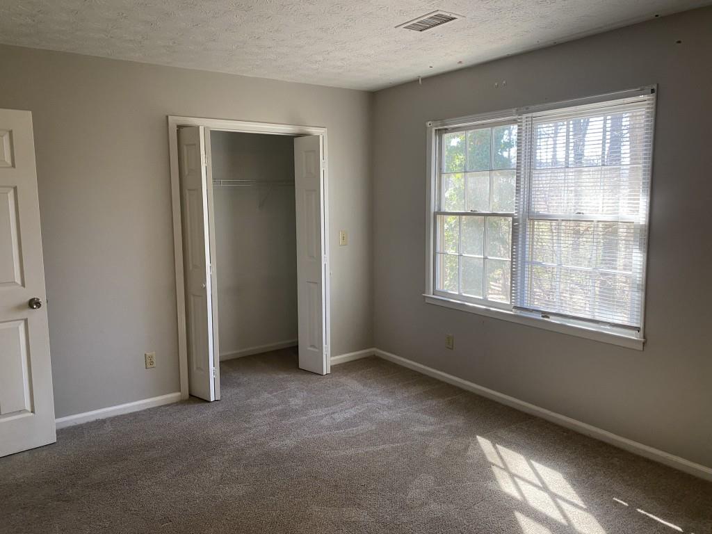 1720 Ridgefield Drive Roswell, GA 30075 - Photo 22 of 35 an empty room with windows