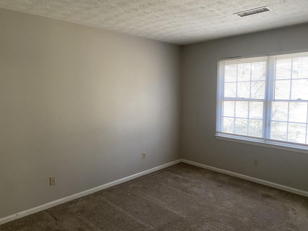 1720 Ridgefield Drive Roswell, GA 30075 - Photo 23 of 35 an empty room with a window