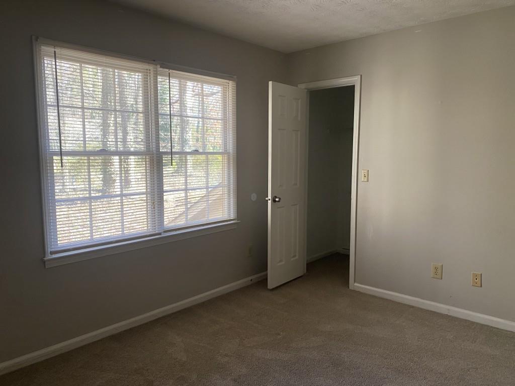 1720 Ridgefield Drive Roswell, GA 30075 - Photo 27 of 35 an empty room with a window