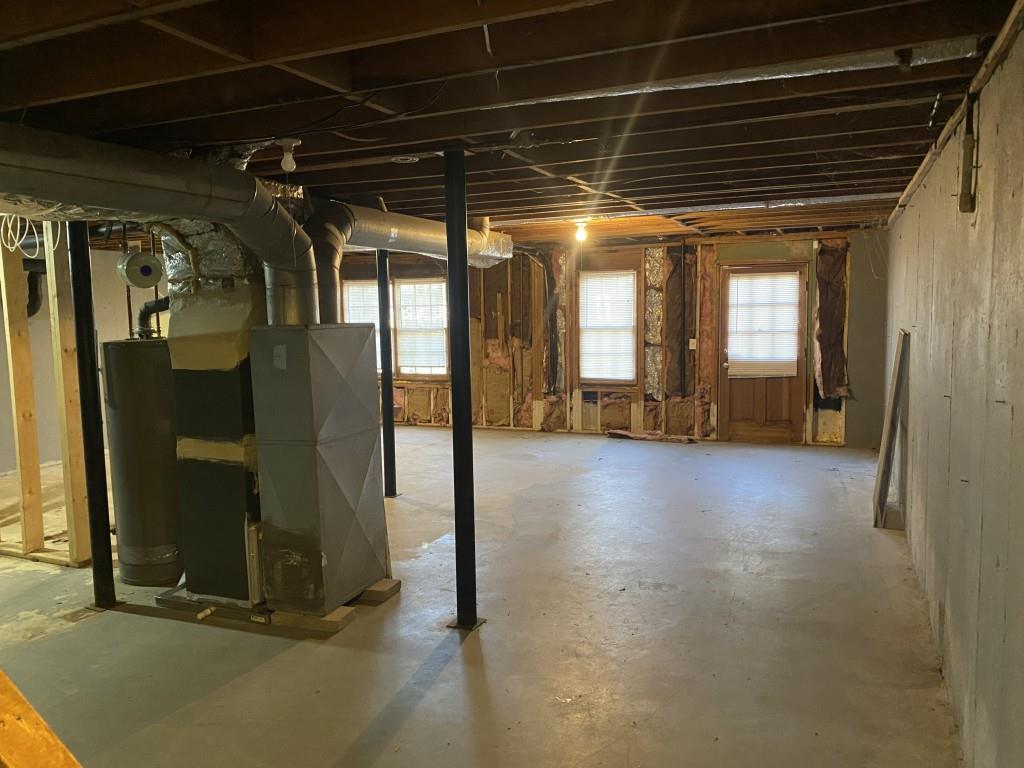 1720 Ridgefield Drive Roswell, GA 30075 - Photo 29 of 35 a view of water heater room with glass door
