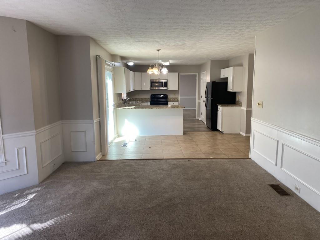 1720 Ridgefield Drive Roswell, GA 30075 - Photo 5 of 35 a view of kitchen with refrigerator and window