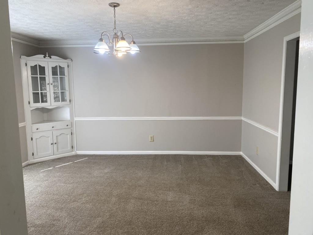 1720 Ridgefield Drive Roswell, GA 30075 - Photo 9 of 35 a view of an empty room with a window