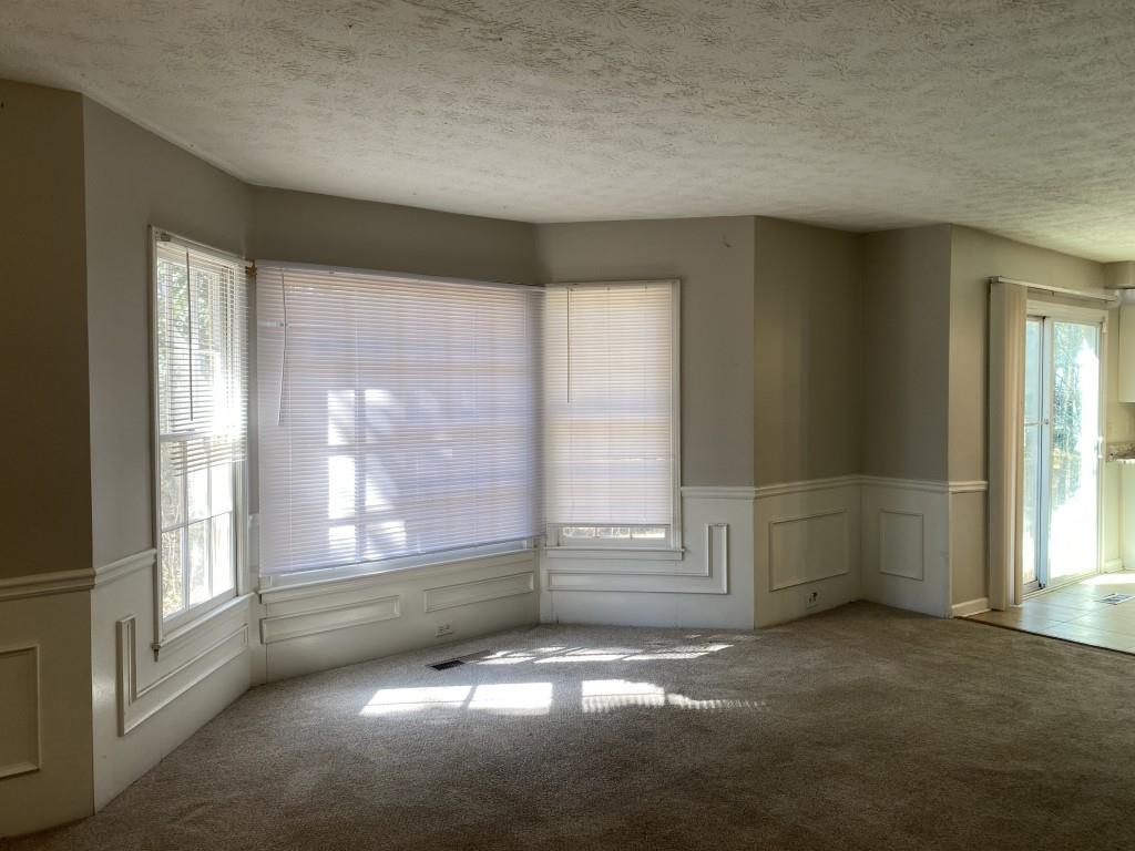 1720 Ridgefield Drive Roswell, GA 30075 - Photo 10 of 35 an empty room with windows