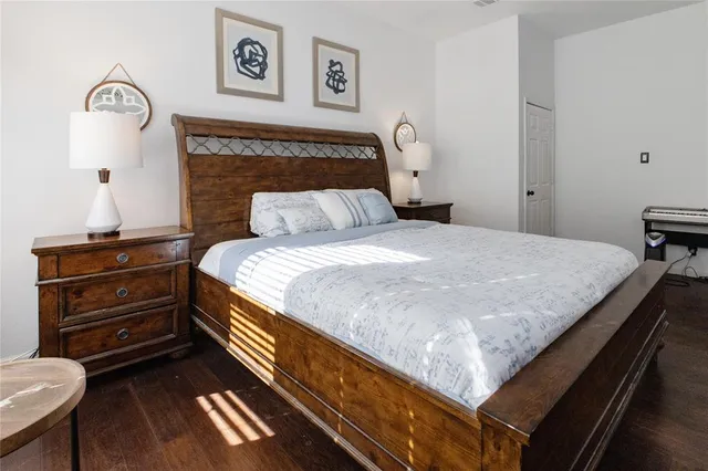 a bedroom with a bed and a desk