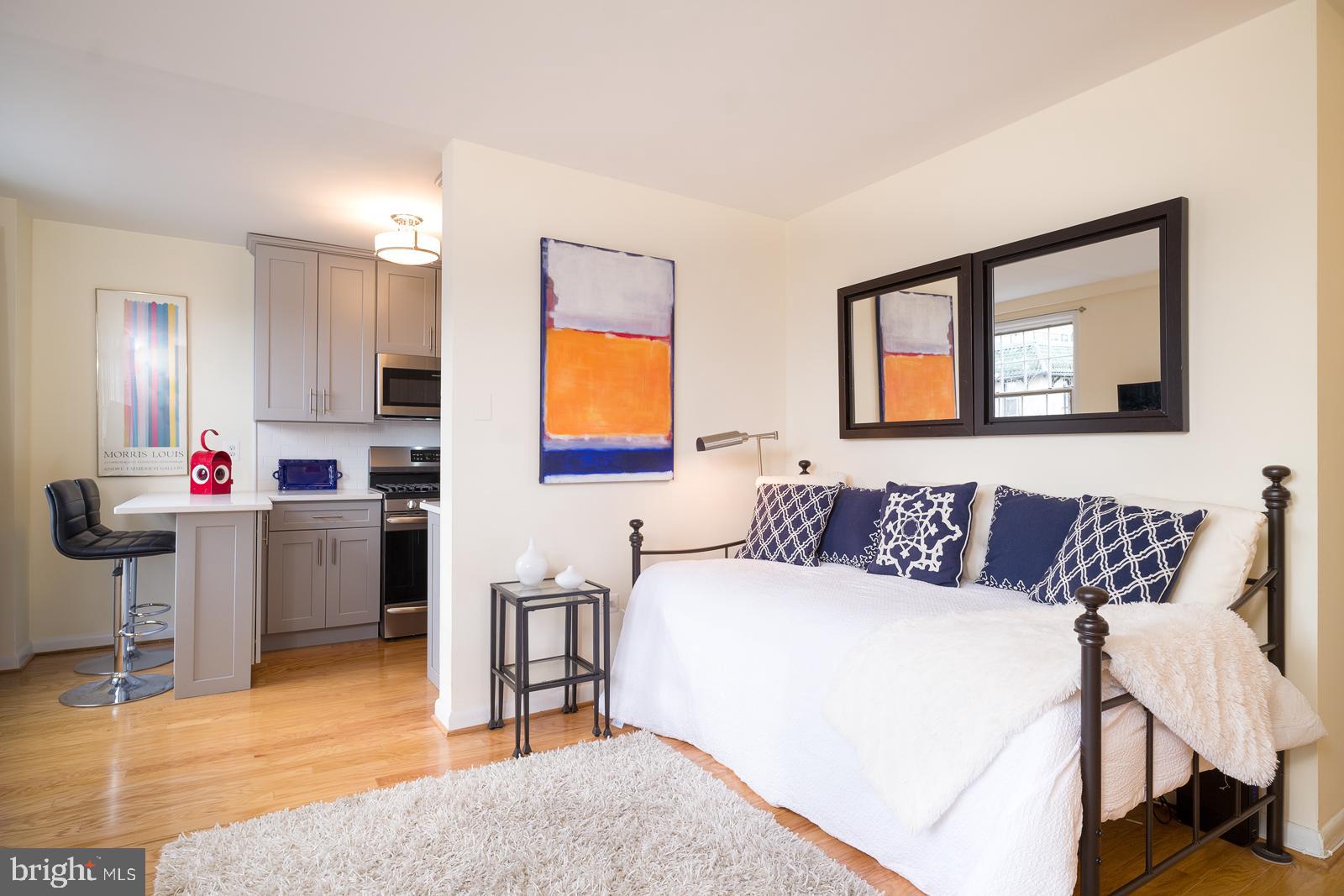 1880 Columbia Road Northwest, Unit 405 Washington, DC 20009 - Photo 3 of 17 Light Hardwood floors