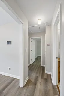a bathroom with a granite countertop sink a toilet and a bathtub