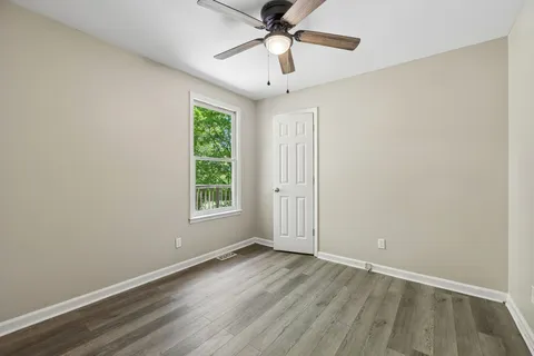 a view of balcony with wooden floor