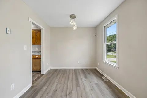 a kitchen with stainless steel appliances granite countertop a stove microwave and refrigerator