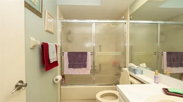 a bathroom with a tub and shower
