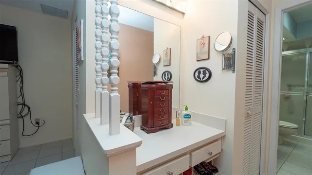 a room with cabinets and chandelier