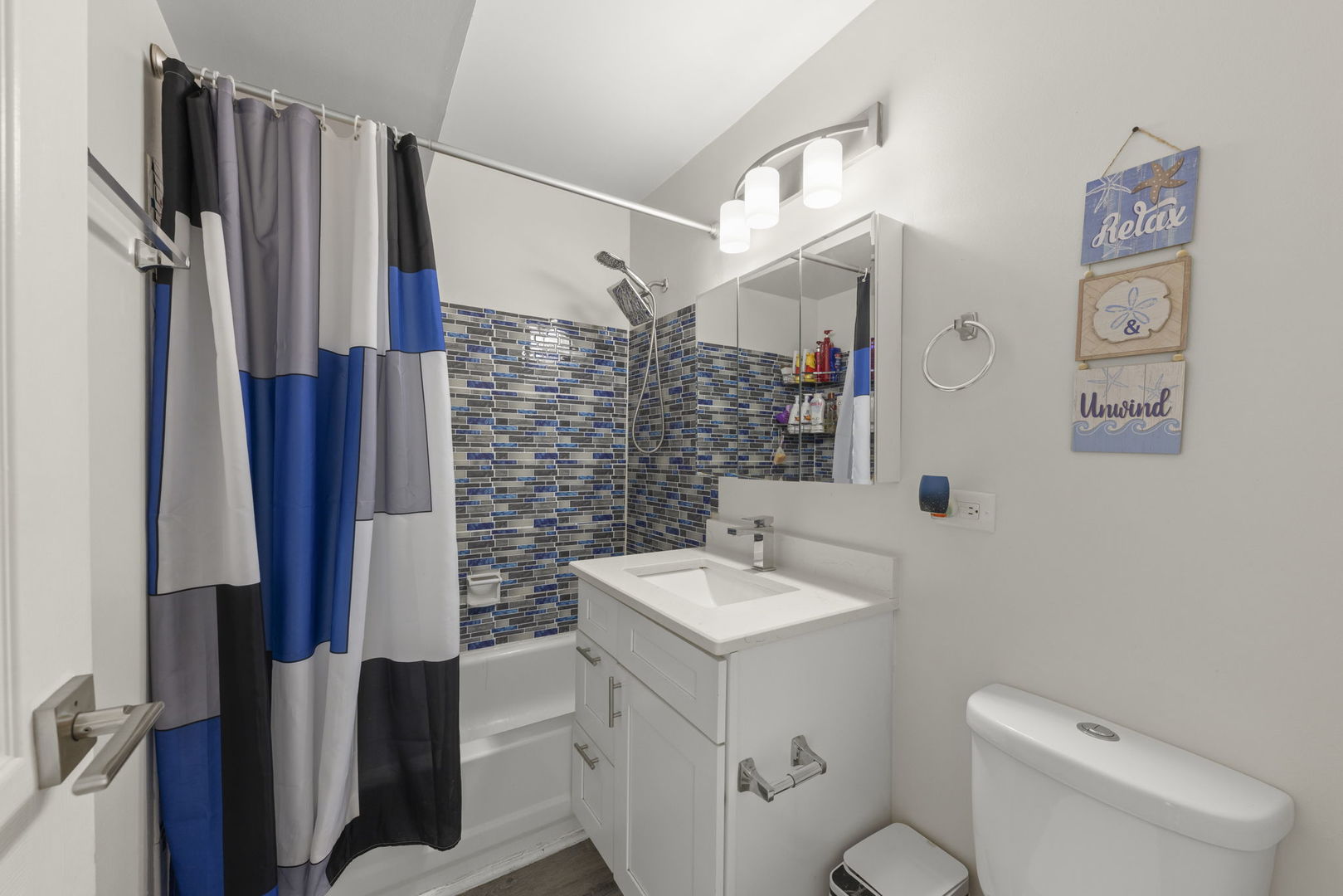 1002 Spruce Street, Unit 2B Glendale Heights, IL 60139 - Photo 11 of 16 a bathroom with a sink a toilet and shower