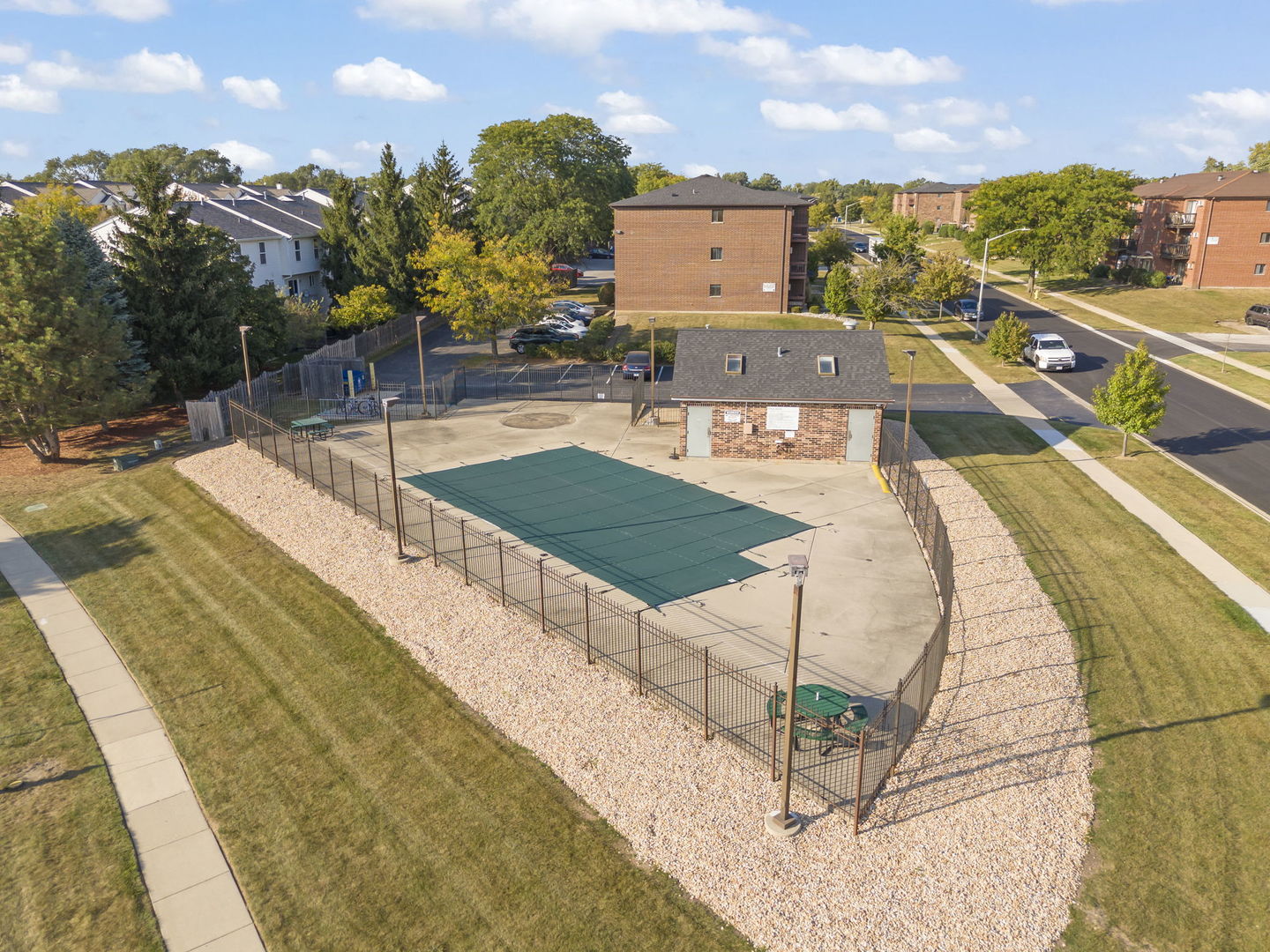 1002 Spruce Street, Unit 2B Glendale Heights, IL 60139 - Photo 15 of 16 a view of a swimming pool with a lounge chairs