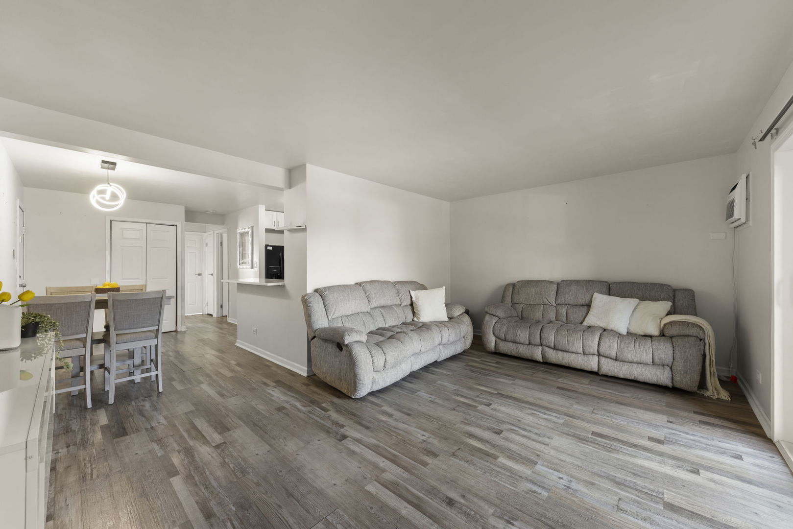 1002 Spruce Street, Unit 2B Glendale Heights, IL 60139 - Photo 2 of 16 a living room with furniture and a wooden floor