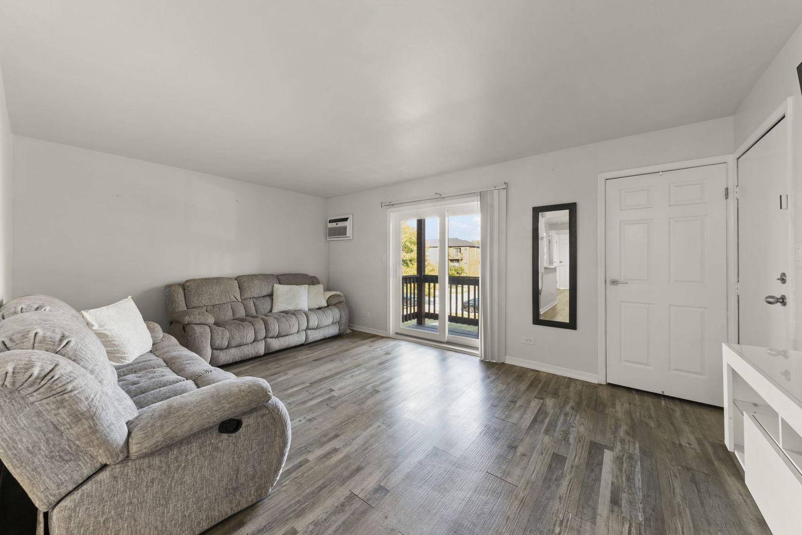 1002 Spruce Street, Unit 2B Glendale Heights, IL 60139 - Photo 3 of 16 a living room with furniture and a wooden floor