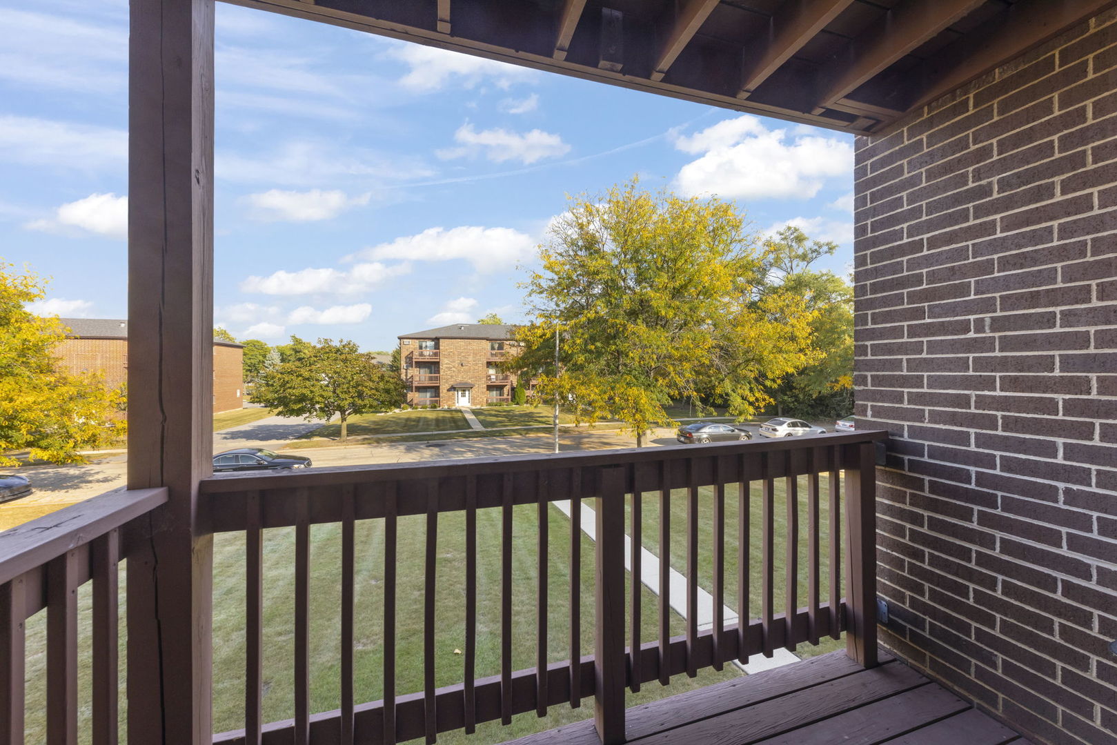 1002 Spruce Street, Unit 2B Glendale Heights, IL 60139 - Photo 4 of 16 a view of a balcony with wooden floor