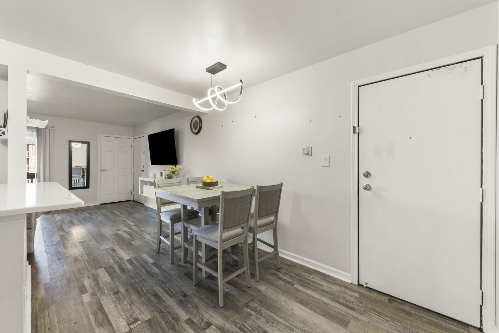 1002 Spruce Street, Unit 2B Glendale Heights, IL 60139 - Photo 5 of 16 a view of a dining room with furniture and wooden floor