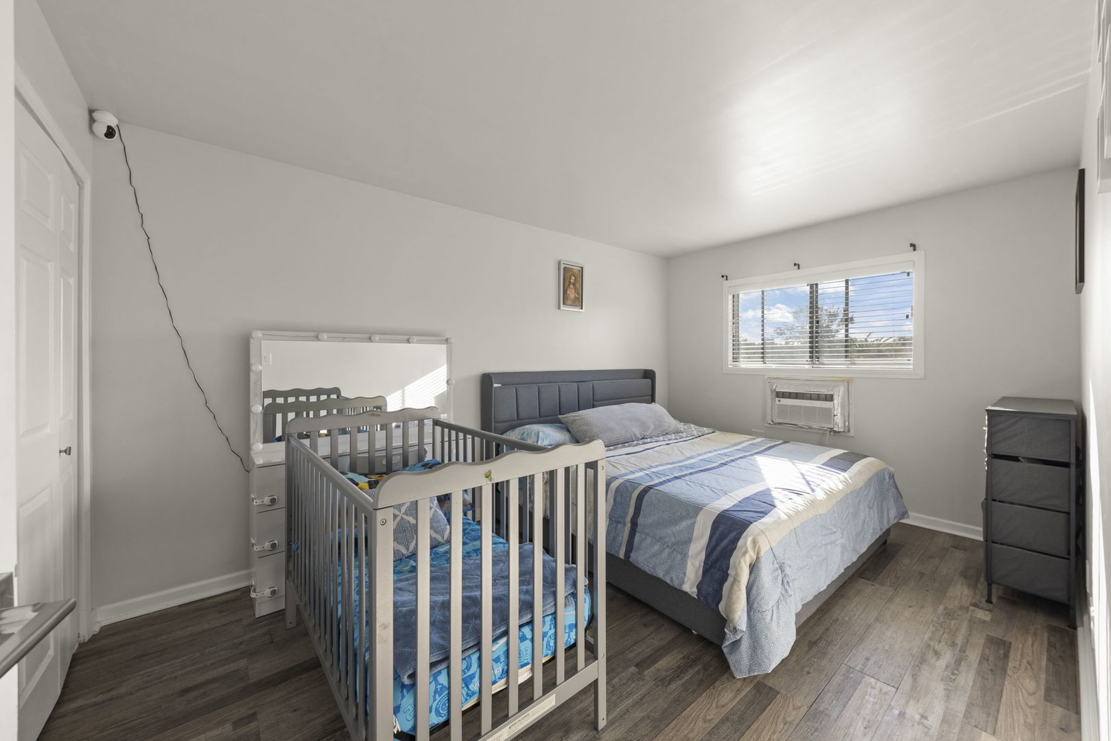 1002 Spruce Street, Unit 2B Glendale Heights, IL 60139 - Photo 9 of 16 a bedroom with a bed and a window