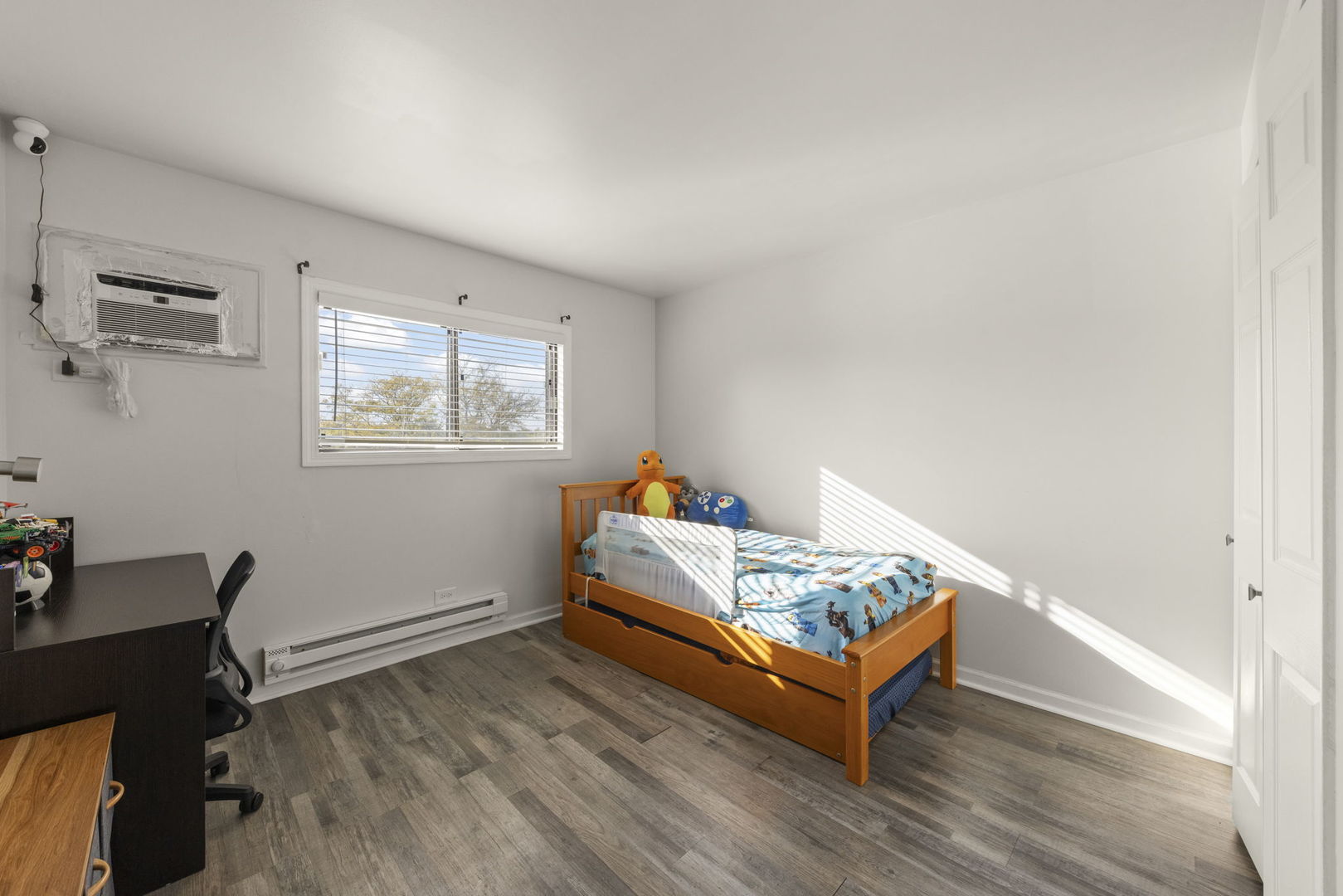 1002 Spruce Street, Unit 2B Glendale Heights, IL 60139 - Photo 10 of 16 a bedroom with furniture and a window
