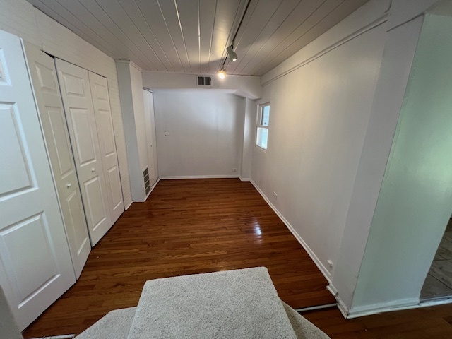 14935 West Old School Road, Unit 2 Libertyville, IL 60048 - Photo 17 of 32 a view of hallway with wooden floor