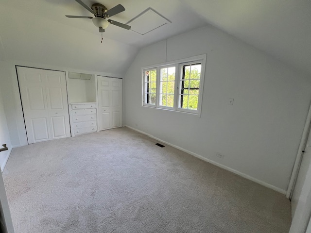 14935 West Old School Road, Unit 2 Libertyville, IL 60048 - Photo 19 of 32 an empty room with a window and a fan