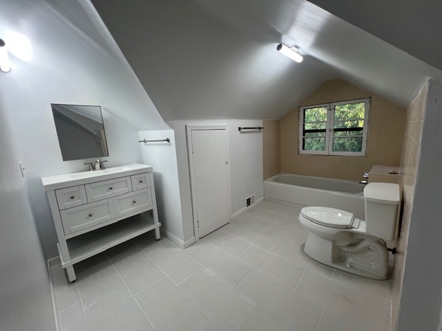 14935 West Old School Road, Unit 2 Libertyville, IL 60048 - Photo 23 of 32 a bathroom with a toilet sink and mirror